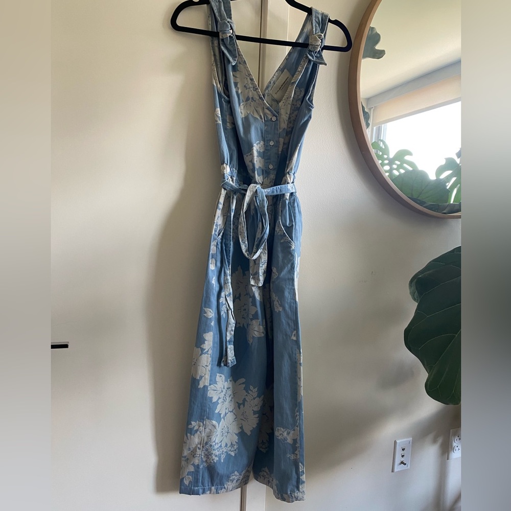 Anthropologie denim floral pattern jumpsuit with shoulder detailing